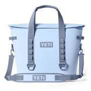 A blue sale YETI Hopper M30 soft cooler with shoulder straps and handles.